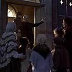 Richard E. Grant, Patrick Stewart, Saskia Reeves, and Ben Tibber in A Christmas Carol (1999)
