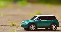 Free Green Scale Model Car on Brown Pavement Stock Photo