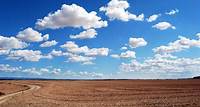 Free Brown Field and Blue Sky Stock Photo