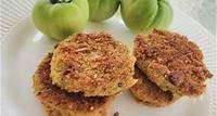 Fried green tomatoes on white plate with some green tomatoes in background
