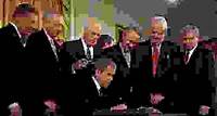 Pres. George W. Bush signing the USA PATRIOT Act in the East Room of the White House, Washington, D.C., October 26, 2001.
