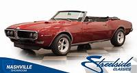 This 1968 Pontiac Firebird Convertible LS Restomod glows in a radiant red finish, presenting itself