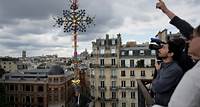 Notre Dame cathedral cross reinstalled in Paris amid restoration efforts