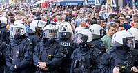 Riot police out in force as England fans take over another German city at Euros