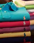 Stacked folded Polo shirts in various hues.