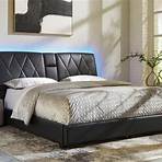 Rent Signature Design by Ashley Beckilore Queen Upholstered Bed- Black