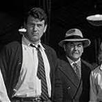 Rock Hudson, Dorothy Malone, Robert Middleton, and Alan Reed in The Tarnished Angels (1957)