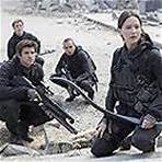 Evan Ross, Jennifer Lawrence, Liam Hemsworth, and Sam Claflin in The Hunger Games: Mockingjay - Part 2 (2015)
