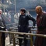 Christian Bale, Christopher Nolan, and Ken Watanabe in Batman Begins (2005)