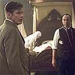 The Curious Case of Benjamin Button--Jason Flemyng as Thomas Button and David Jensen as the doctor at Benjamins birth.