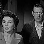 Tom Conway and Lisa Ferraday in Death of a Scoundrel (1956)