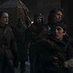 Alfie Allen, Isaac Hempstead Wright, and Megan Parkinson in Game of Thrones (2011)