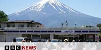 Japanese town blocks iconic Mount Fuji view to deter tourists | BBC News