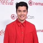 How did Henry Golding grow up?4