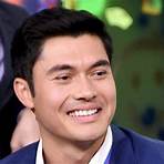How did Henry Golding grow up?1
