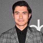 How did Henry Golding grow up?2