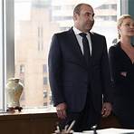 How does Harvey manage to get Fox to buy the building?3