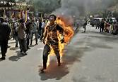 Tibetan man sets himself on fire in protest - Photos