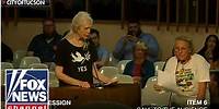 Two residents make a plea through song during town hall