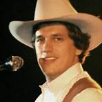 When did George Strait have a full head of hair?2