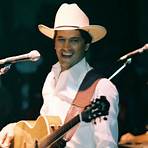 When did George Strait have a full head of hair?1